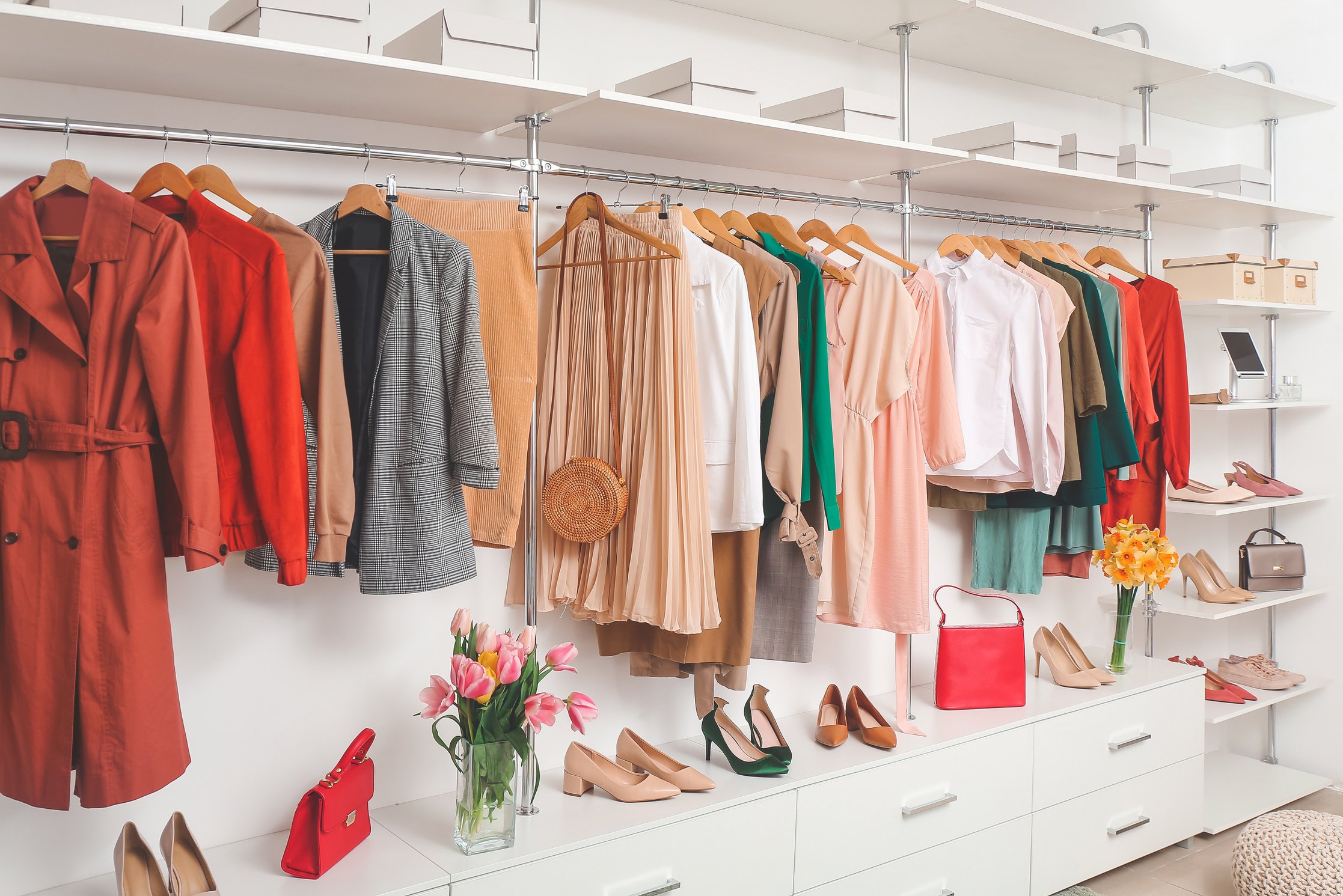 a walk-in wardrobe edit with well organised stylish clothes and shoes.